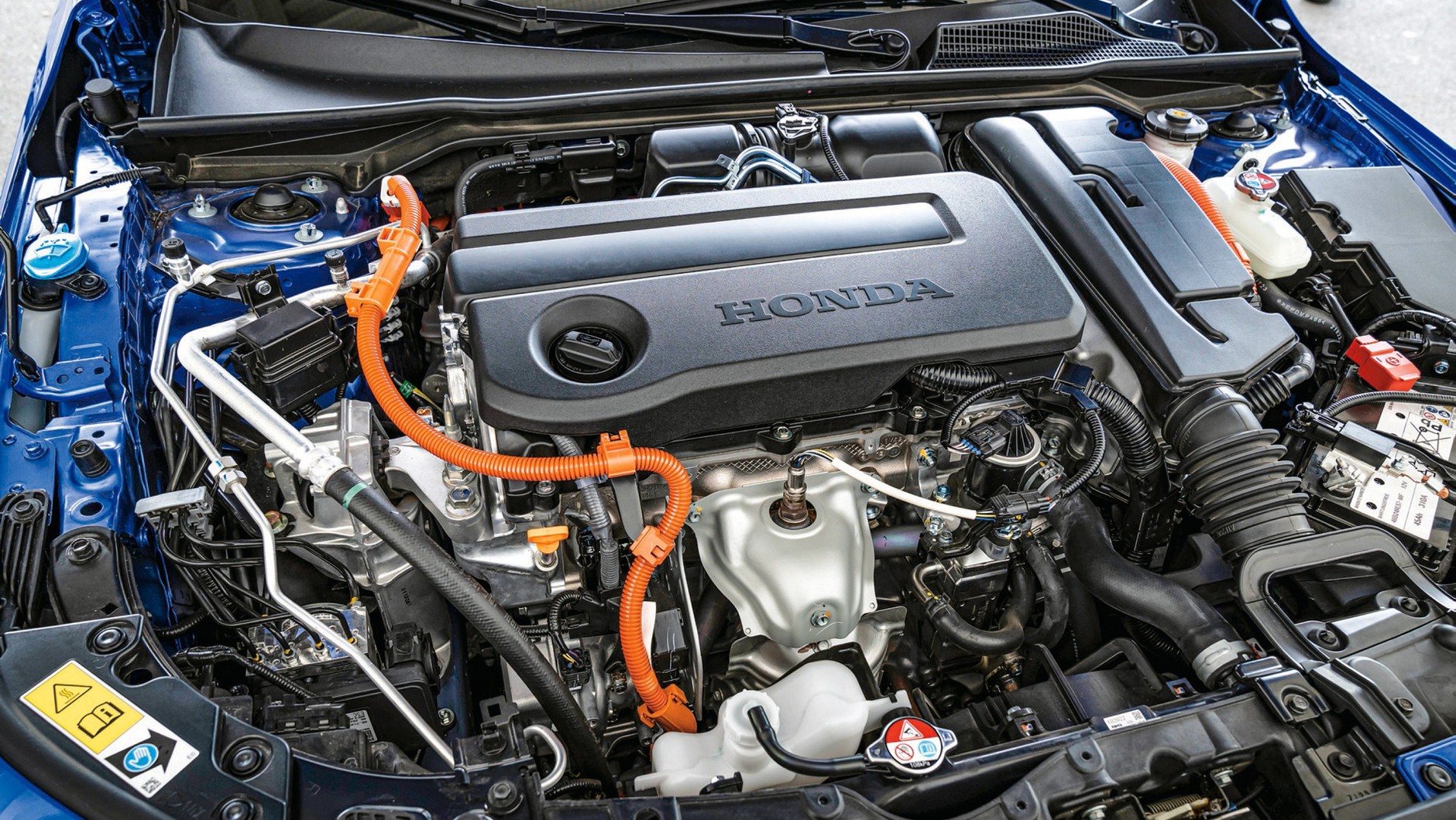 Honda Civic: znak rozpoznawczy elektryki pod maską to pomarańczowe kable zasilające. Oto pełna hybryda Hondy.