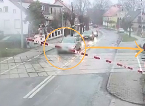 Kierowca nie przejął się opadającym szlabanem. Uratował go dróżnik [WIDEO]