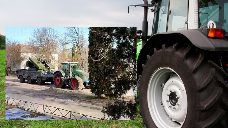 Traktor wywozi transporter opancerzony