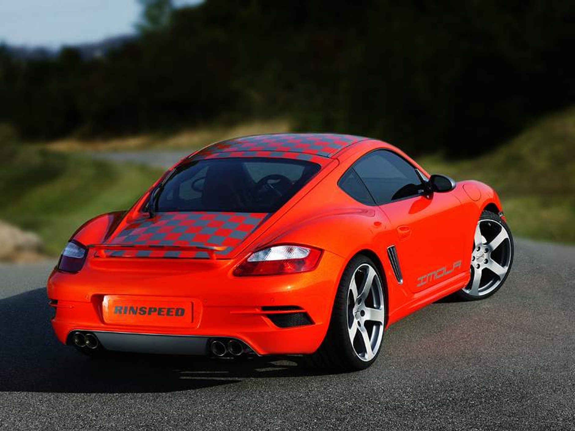 Rinspeed w Paryżu: podrasowany Cayman i Carrera 4