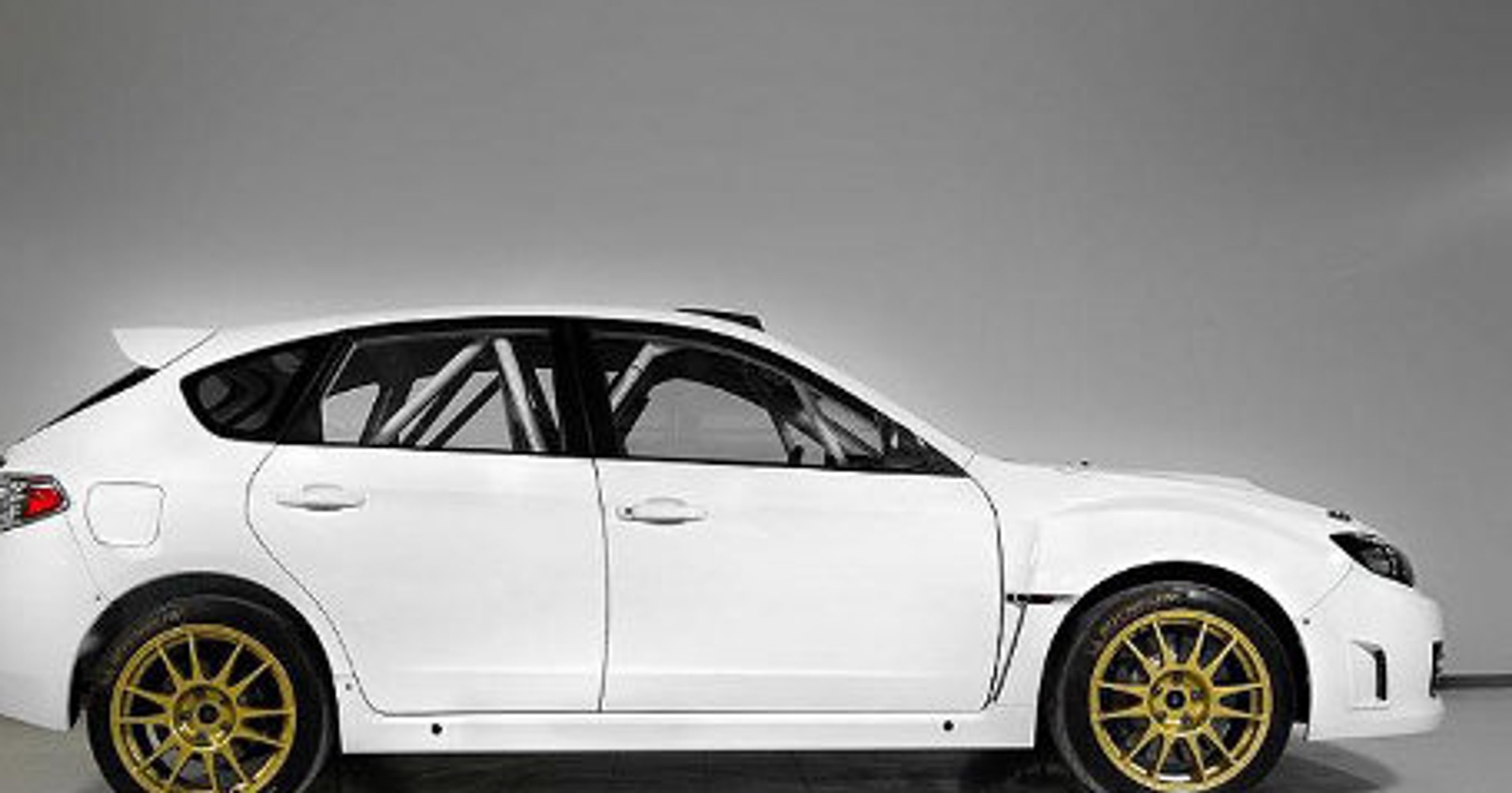 Hołowczyc za kierownicą Subaru Impreza R4