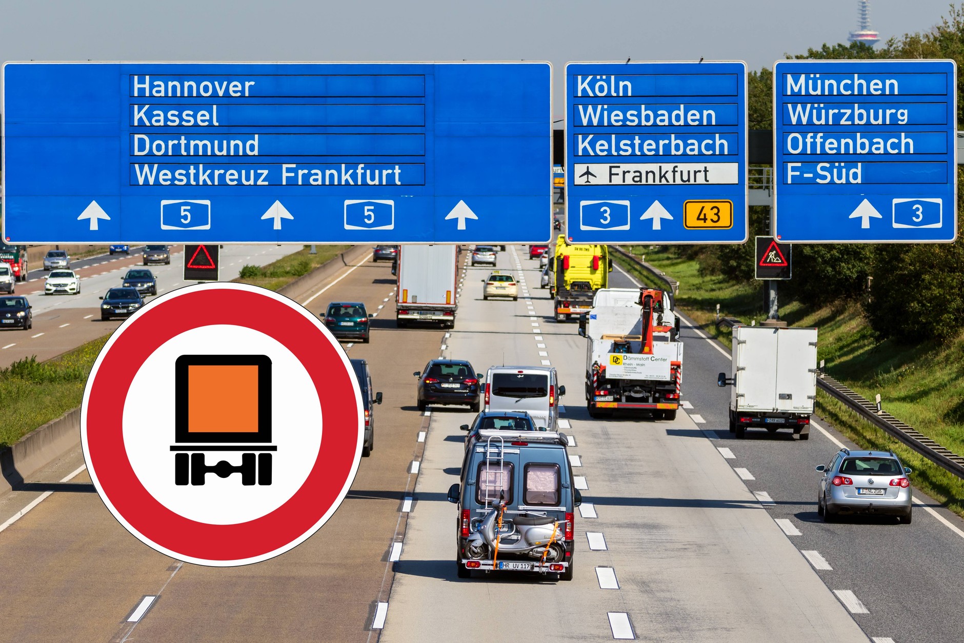 Znak z pomarańczową ciężarówką na niemieckich drogach