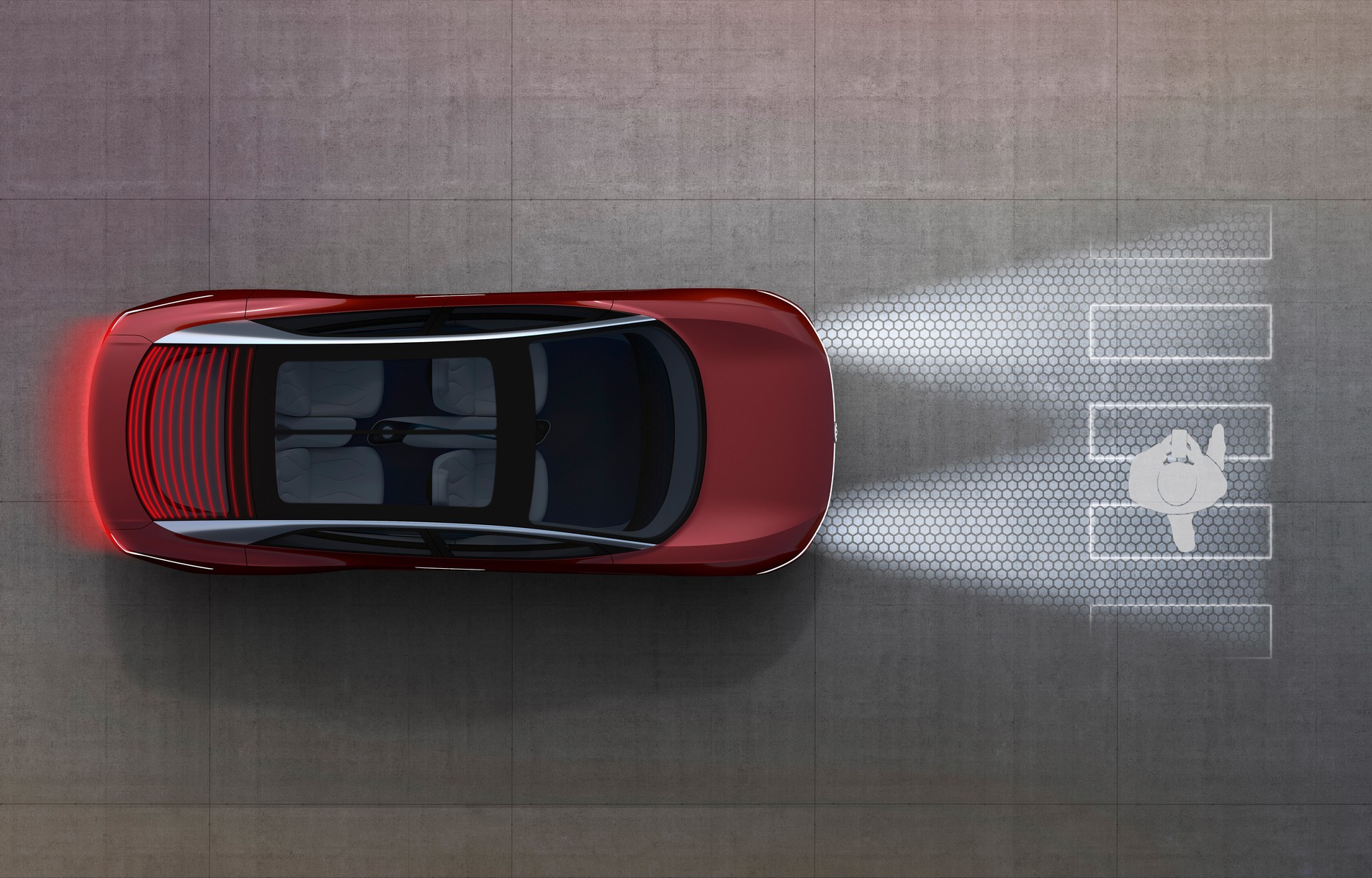 Volkswagen I.D. Vizzion będzie rozpoznawać pieszych i w razie potrzeby ułatwiać przejście przez jezdnię dzięki projekcji odpowiednich grafik na nawierzchnię