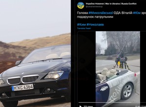 Kabriolet BMW ma z tyłu karabin maszynowy i broni Ukrainy